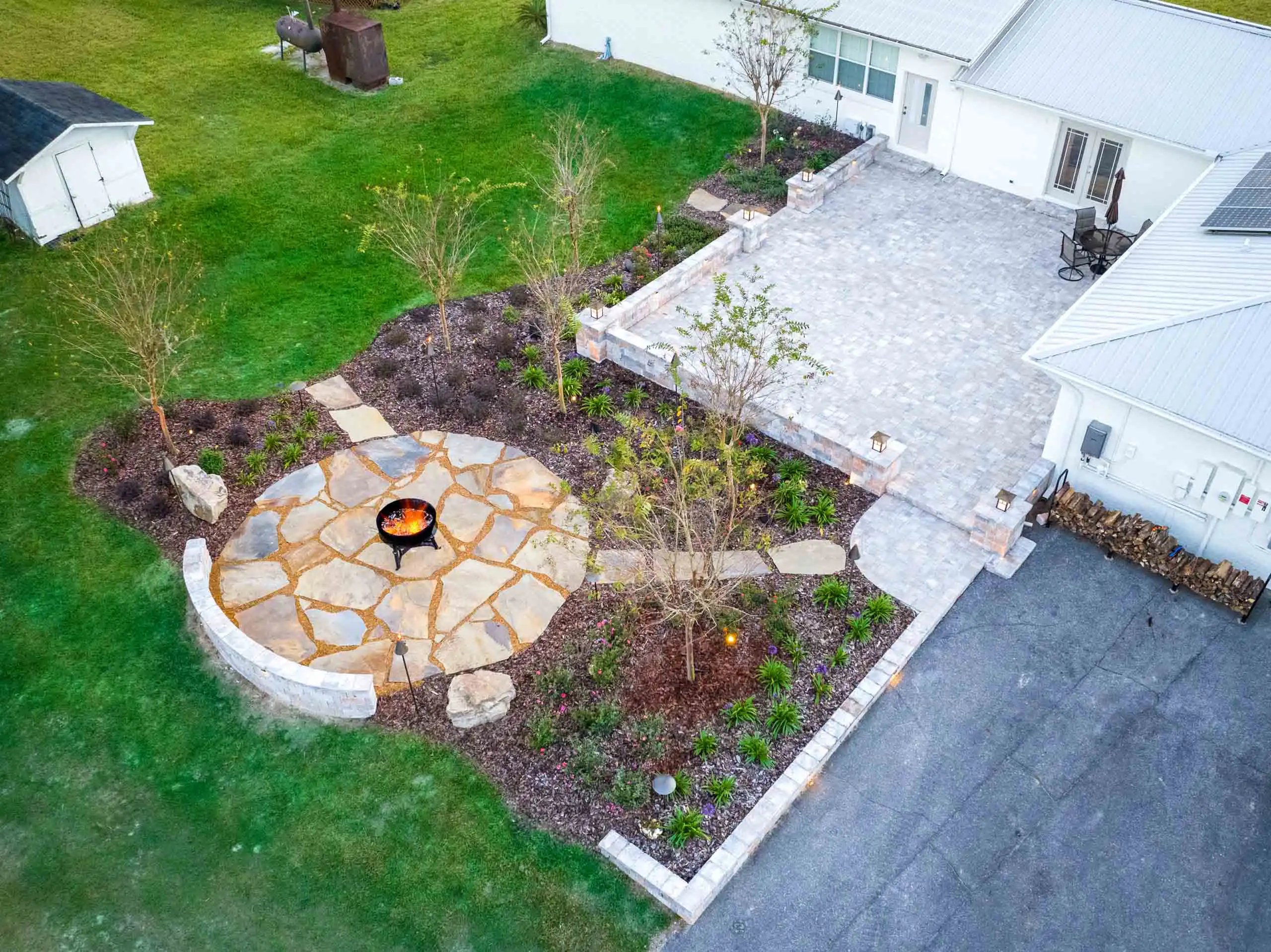 Outdoor living space ideas using custom stone patios.