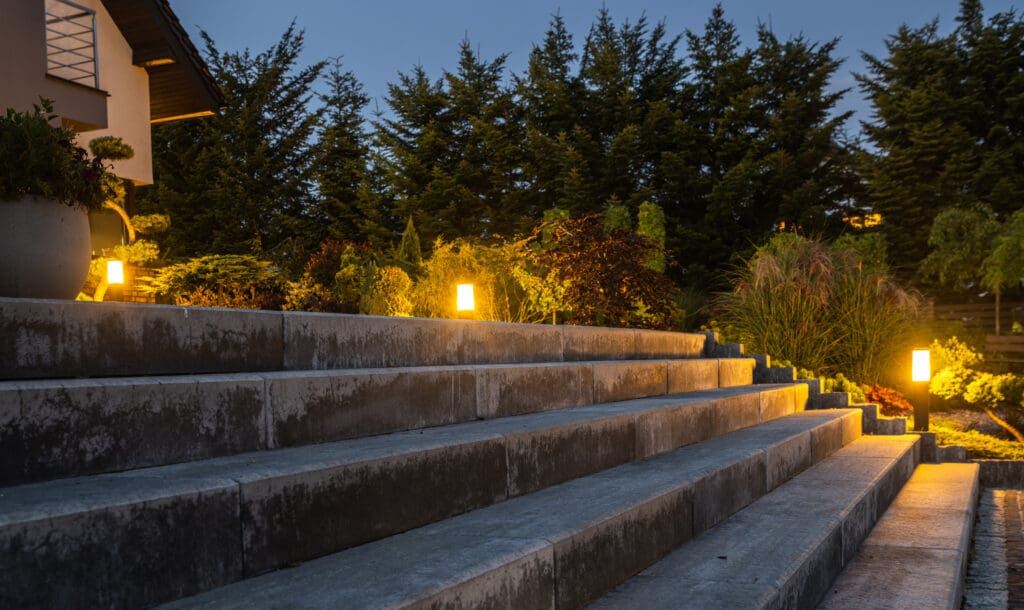 Large Garden Concrete Stairs and Illuminated Rockery Garden. Residential Architecture.