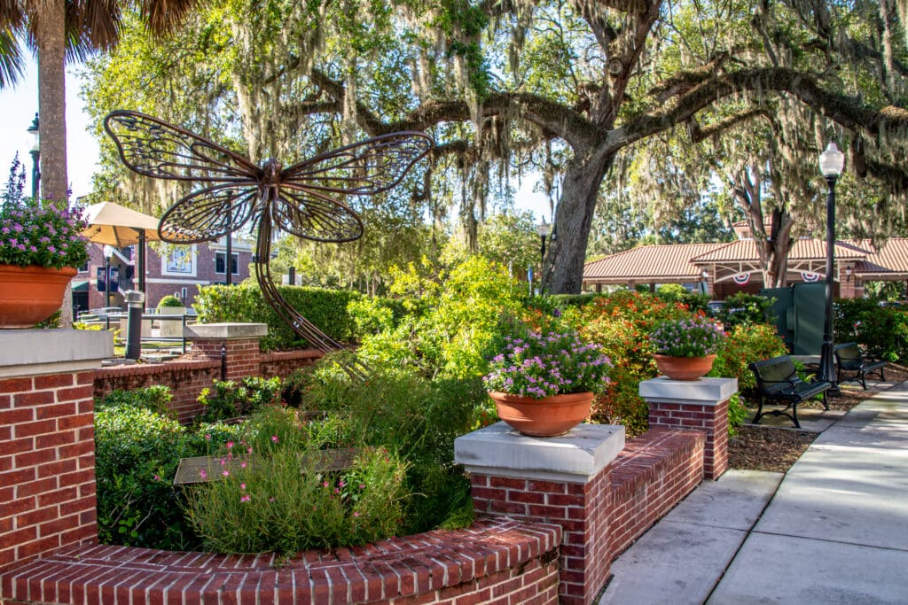 Butterfly Garden. Historic brick buildings, storefronts, and restaurants in Winter Garden Florida. The city is in the Central Florida, Orlando area and is known for it's quaint and charming downtown vibe. An excellent example of a revived and treasured historic city, Florida travel destination.