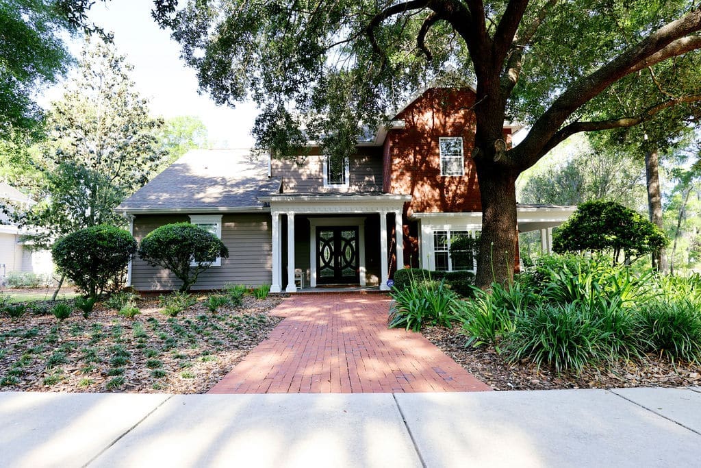 Landscape with large oak tree and mulched ground cover