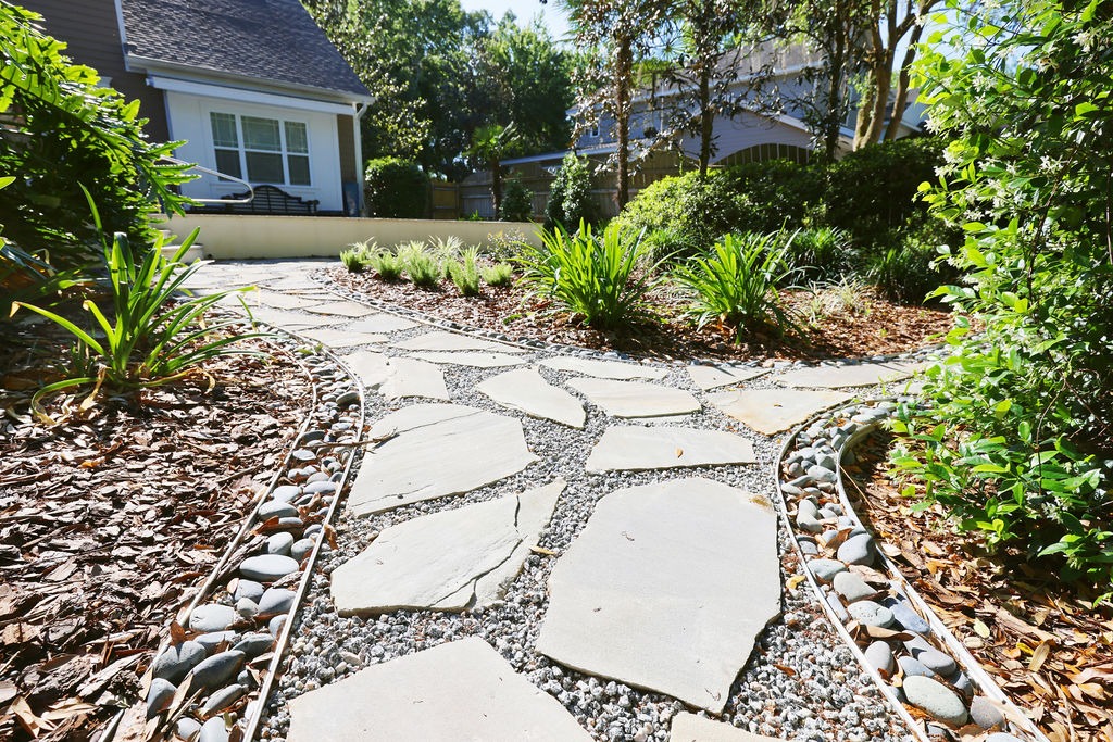 Flagstone garden path leading to a house patio